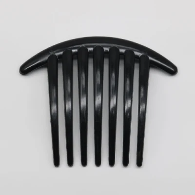 Fermoir en plastique noir fabriqué en Chine 7 dents pour décorer et masser vos cheveux.